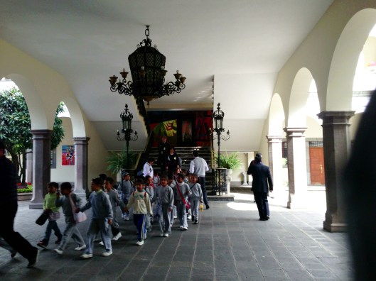 Children on a field trip to the "White House," where their country's president resides.