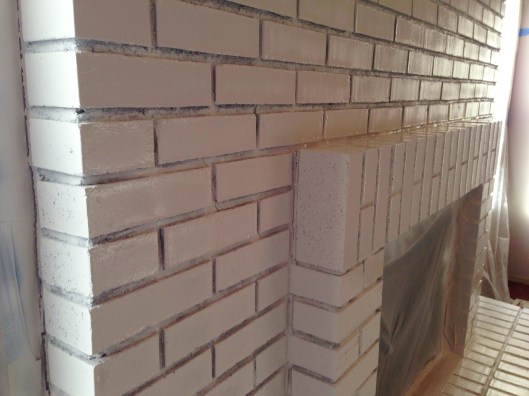 First coat of paint on the fireplace